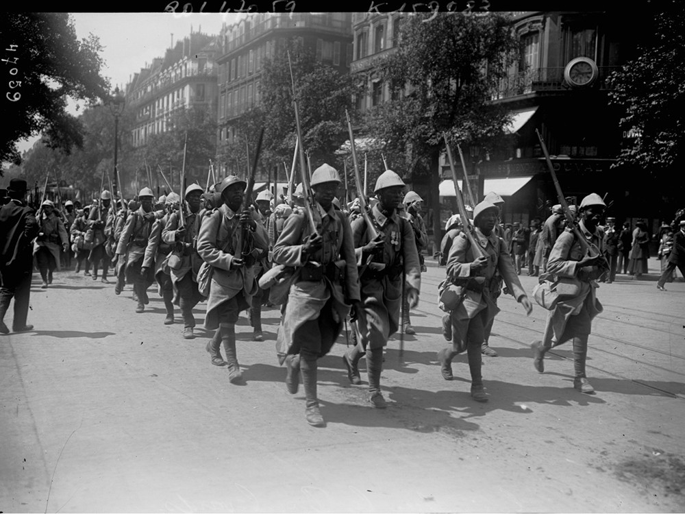 <p style="text-align: center;"><strong>Senegalese troops marching along a boulevard. June 1916.</strong><br style="text-align: center;" /><span style="text-align: center;">Source / Cr&eacute;dit :&nbsp;</span><a style="text-align: center;" href="https://gallica.bnf.fr/ark:/12148/btv1b6946548c/f1.item" target="_blank" rel="noopener">BNF / Gallica</a></p>